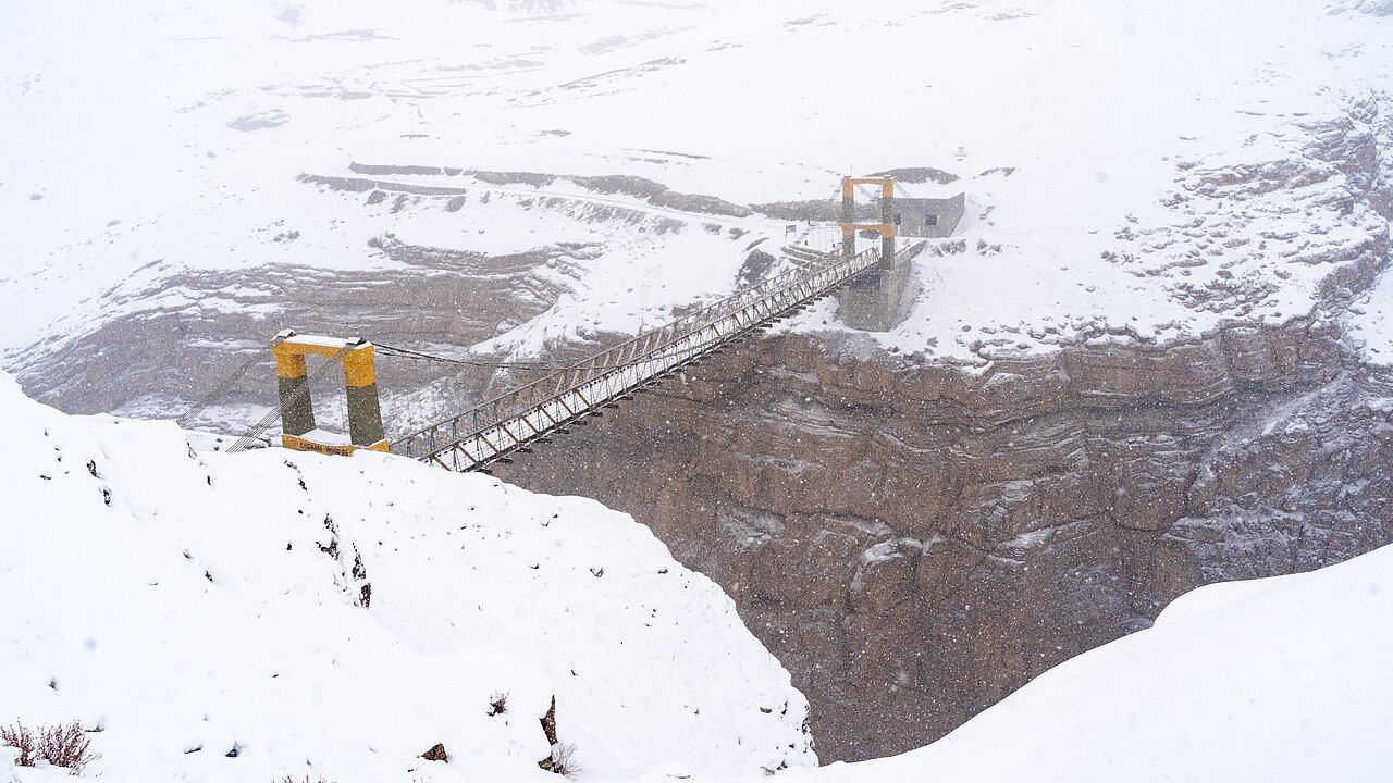 Chicham Bridge over a snowy gorge