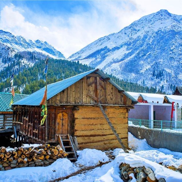 Wooden Kinnauri homestay in snow